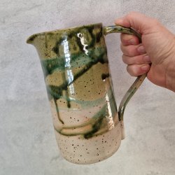 Grnne kander med lava-pletter